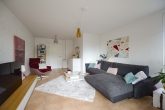Wohnzimmer - Großzügige Erdgeschosswohnung mit gemütlicher Terrasse