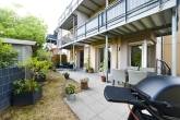 Gartenansicht - Großzügige Erdgeschosswohnung mit gemütlicher Terrasse